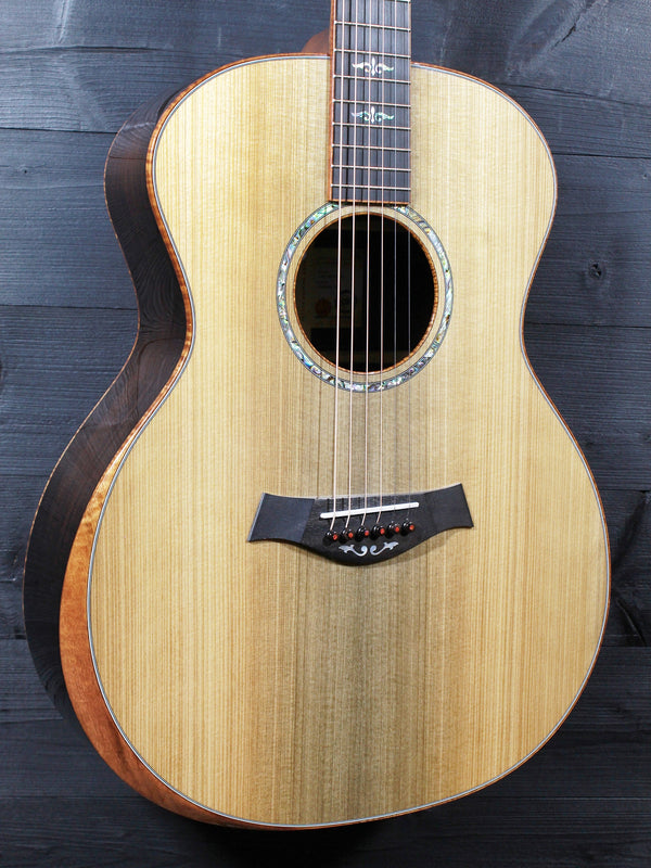 Premium custom Taylor acoustic guitar with koa binding