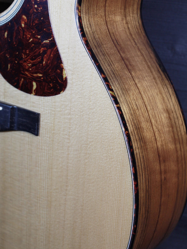 Eastman AC222CE Deluxe solid Sitka Spruce top showing sides and binding