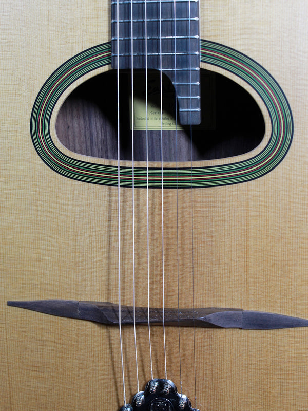 Eastman DM3 Grande Bouche Gypsy Jazz Acoustic Guitar with solid Sitka spruce top and traditional D-hole design at Tobias Music.