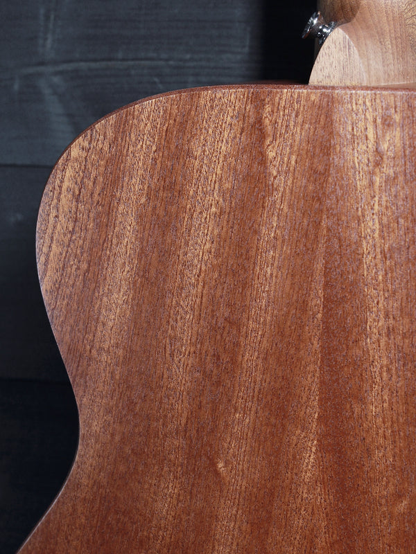 Back of Martin 000-Jr acoustic guitar featuring solid Sapele wood Showing upper bout and heel cap