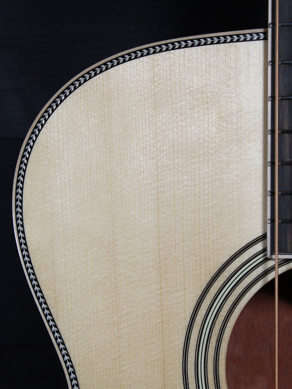 Martin Custom OM acoustic guitar with High Altitude Swiss Spruce top upper bout with Herringbone trim