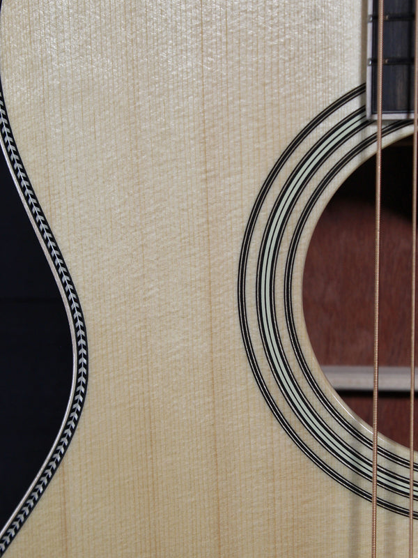 Martin Custom OM acoustic guitar with High Altitude Swiss Spruce top showing rosette
