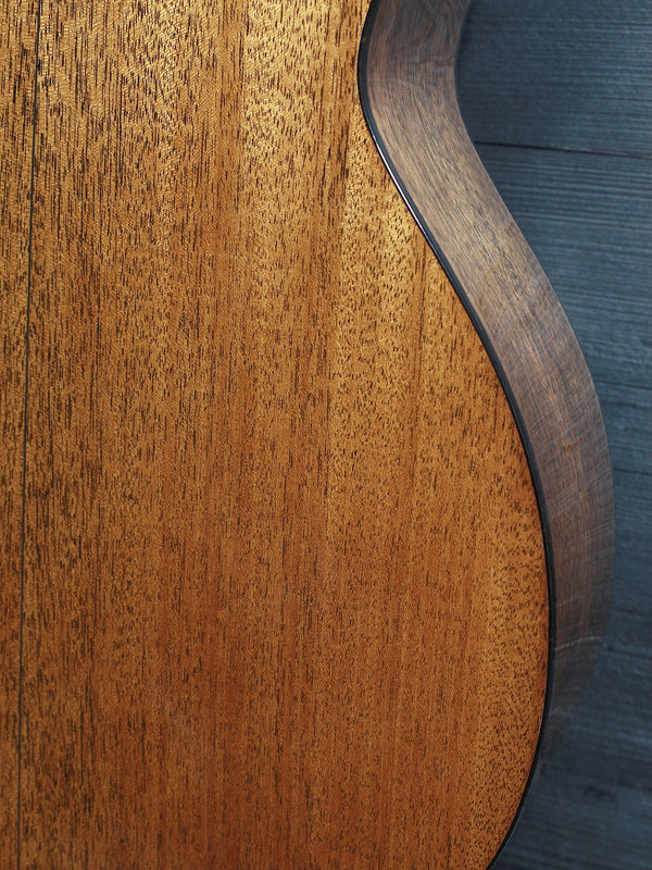 Back of the Martin Custom Shop 00-12 Fret featuring solid mahogany tonewood lower bout wood grain.