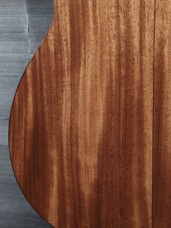 Back of Martin Custom Shop 0000/M guitar showcasing Sinker Mahogany wood grain lower back of guitar