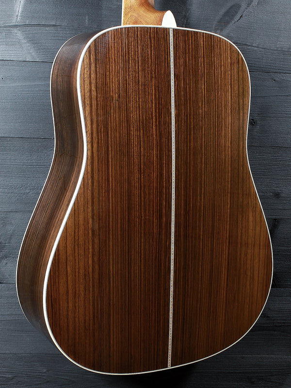 Back glamour shot of a Martin D-41 acoustic guitar featuring the 1933 Ambertone top finish