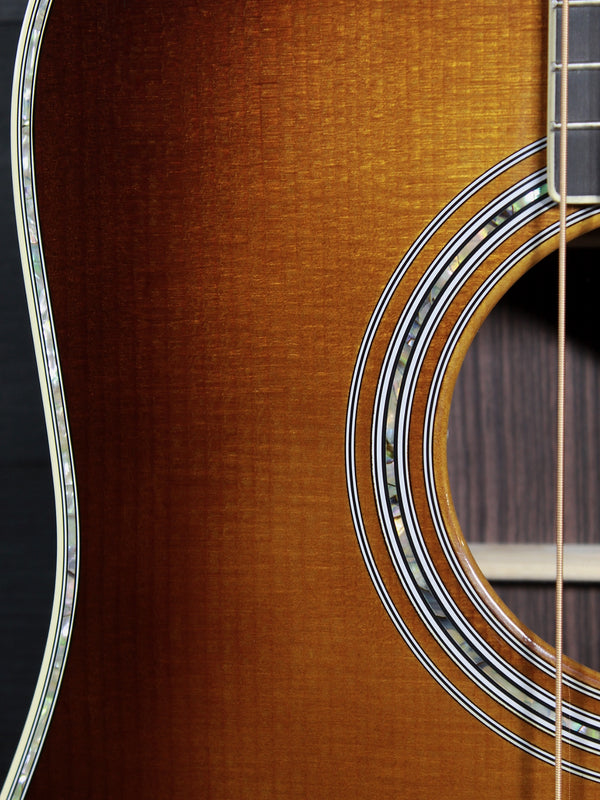 Abalone  Close-up of the vintage-inspired 1933 Ambertone finish on the Martin D-41 showing soundhole and rosette
