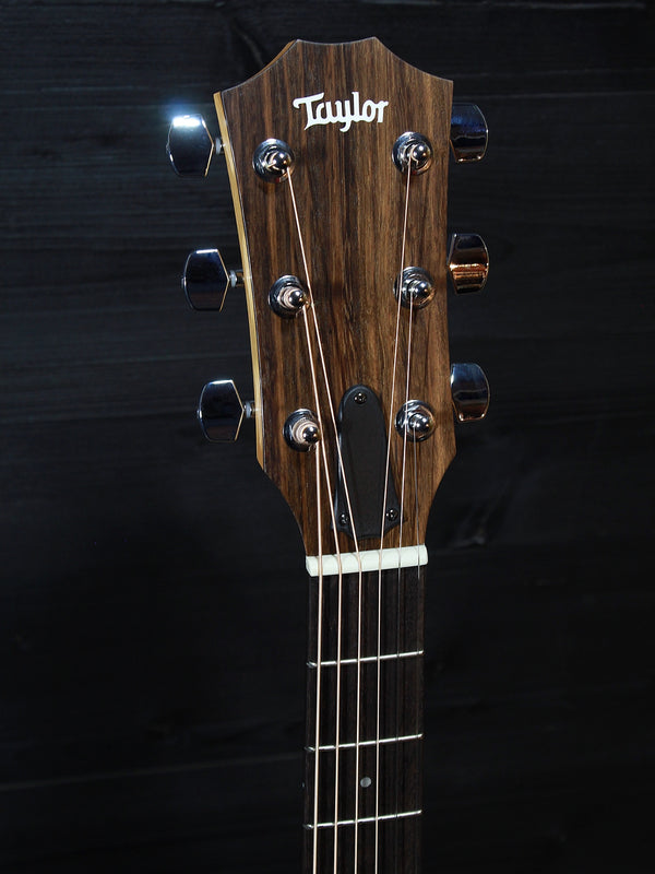Taylor 114ce Dark Tobacco Shaded Edgeburst acoustic-electric guitar showing headstock and tuners