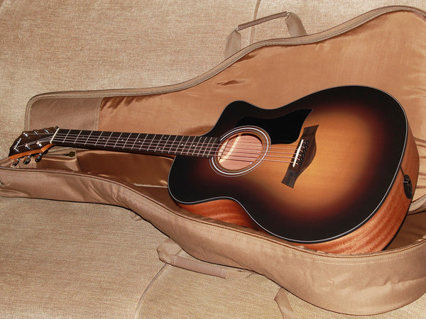 Taylor 114ce Dark Tobacco Shaded Edgeburst acoustic-electric guitar with deluxe gig bag.