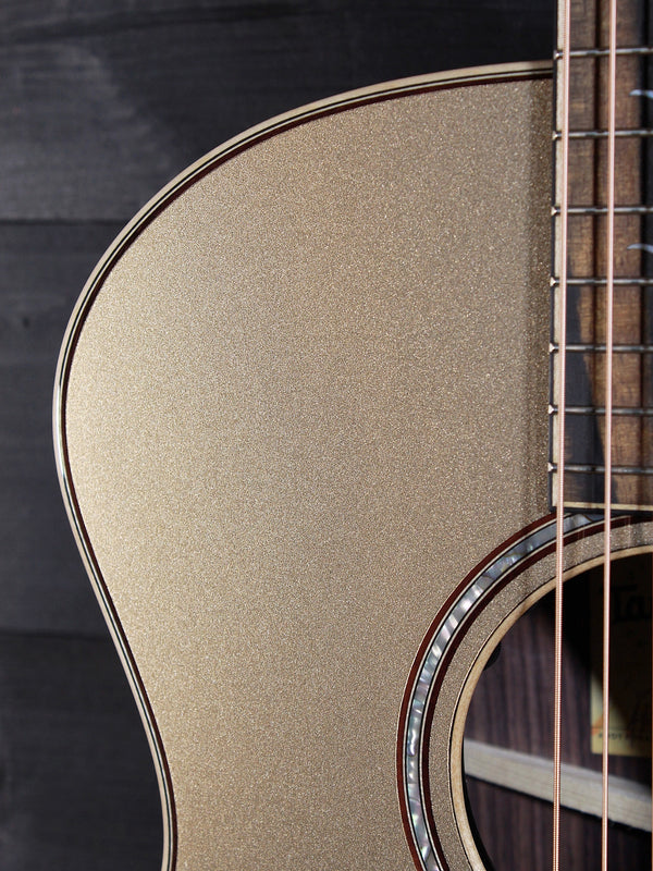 Taylor 814ce Limited Edition Casablanca Beige Metallic acoustic guitar closeup upper bout