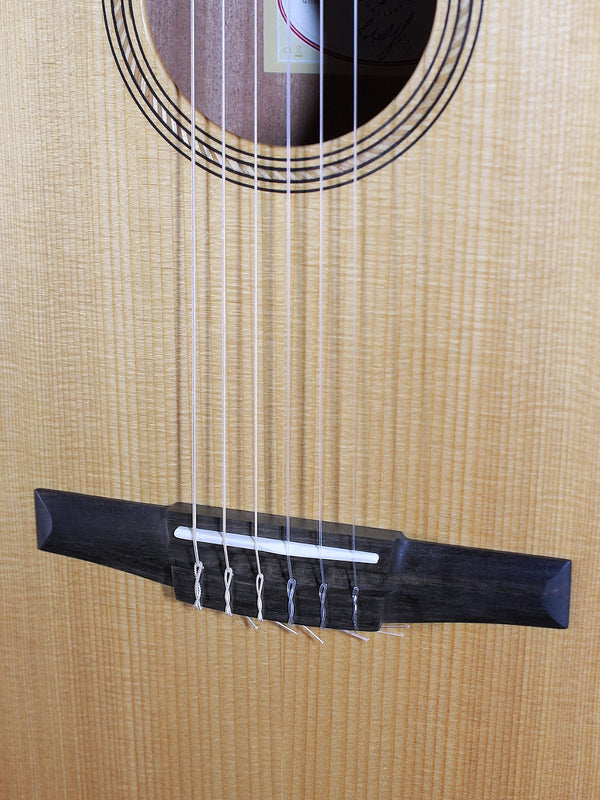 Taylor A12e-N Academy Series nylon string acoustic guitar bridge and saddle