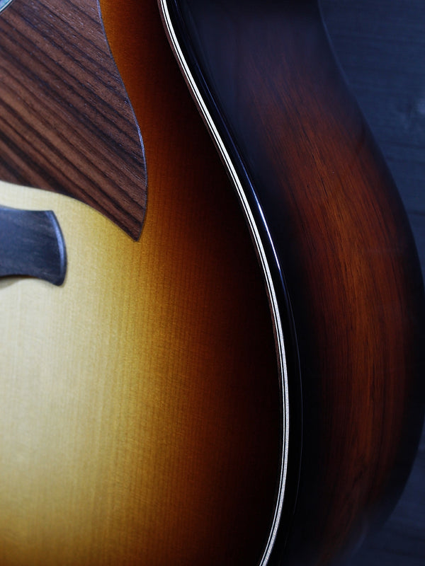 Three-quarter view of the Taylor Builder’s Edition Next Generation 814ce featuring Honduran Rosewood back and sides.