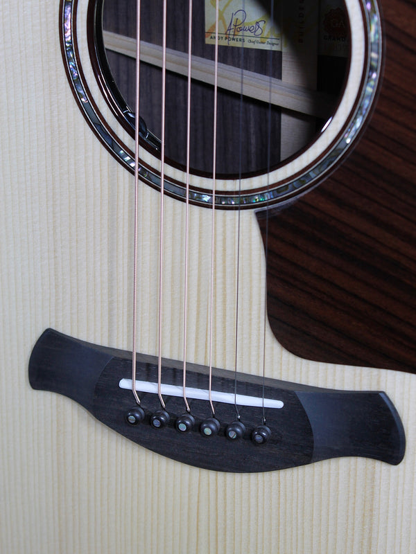 Taylor Builder’s Edition 814ce Next Generation acoustic guitar Bridge and saddle. Ebony bridge pins with abalone dots