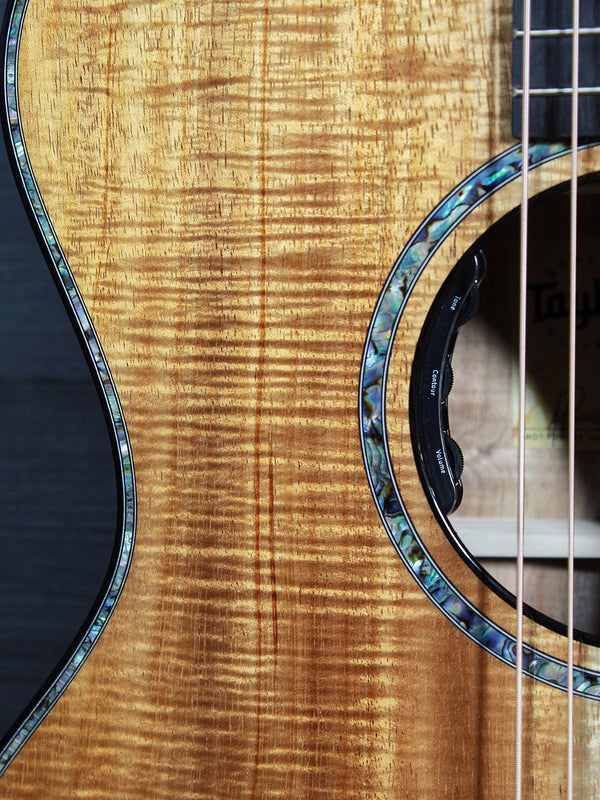 Premium Hawaiian Koa back on Taylor Custom acoustic guitar top with Soundhole, rosette, and electronics