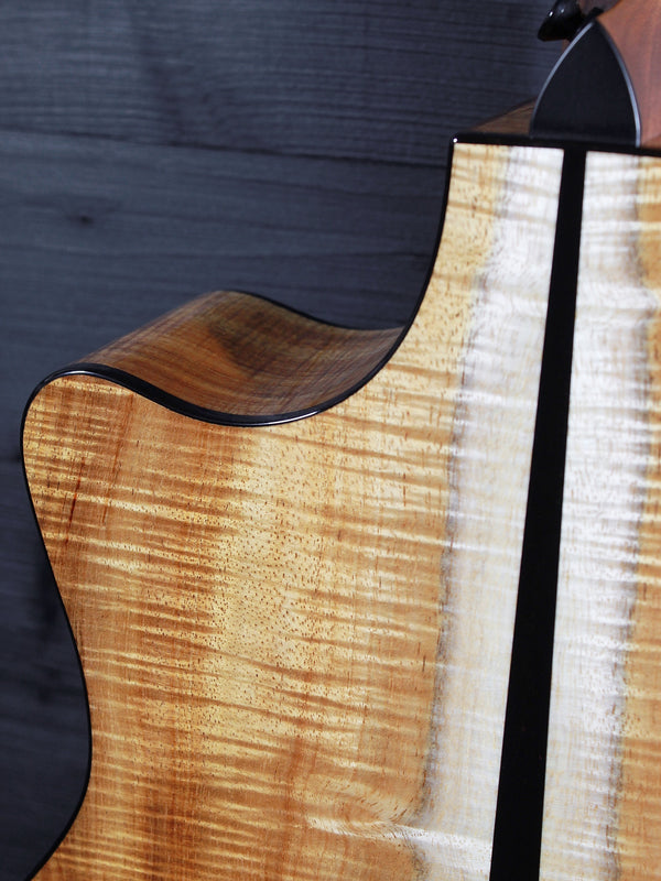 Premium Hawaiian Koa back on Taylor Custom acoustic guitar back view with cutaway