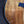 Load image into Gallery viewer, Premium Hawaiian Koa back on Taylor Custom acoustic guitar ebony armrest
