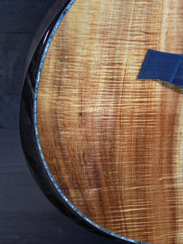 Premium Hawaiian Koa back on Taylor Custom acoustic guitar ebony armrest