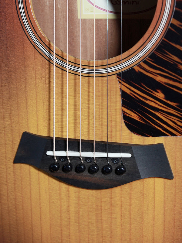 Taylor GS Mini-e SB acoustic-electric guitar with Sunburst finish Bridge and wide wood grain