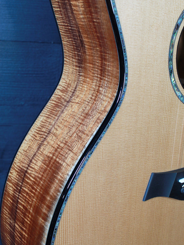 Taylor NAMM C14ce B5028 – GA Western Red Cedar/Figured AA-Grade Hawaiian Koa