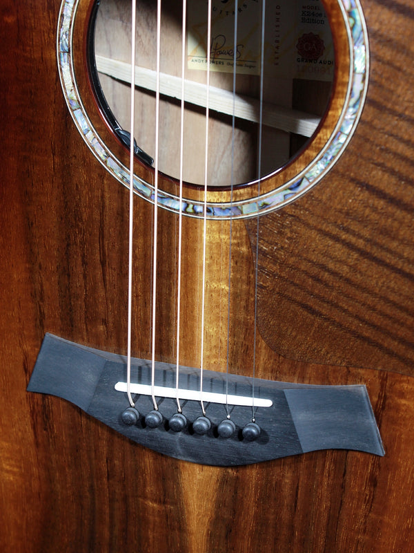 Taylor Next Generation K24ce Special Edition Hawaiian Koa acoustic electric guitar front bridge and saddle
