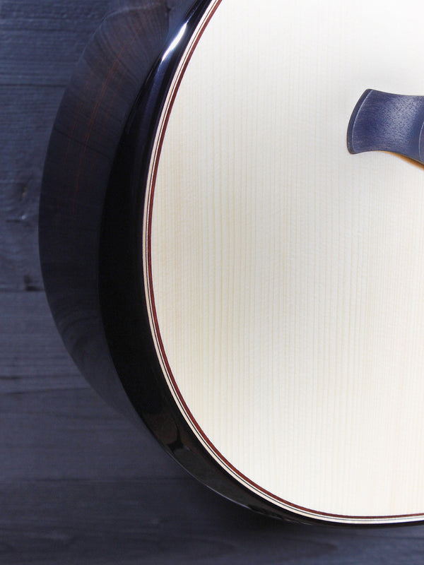 Taylor Next Generation Builder’s Edition 814ce acoustic-electric guitar front view with beveled armrest 